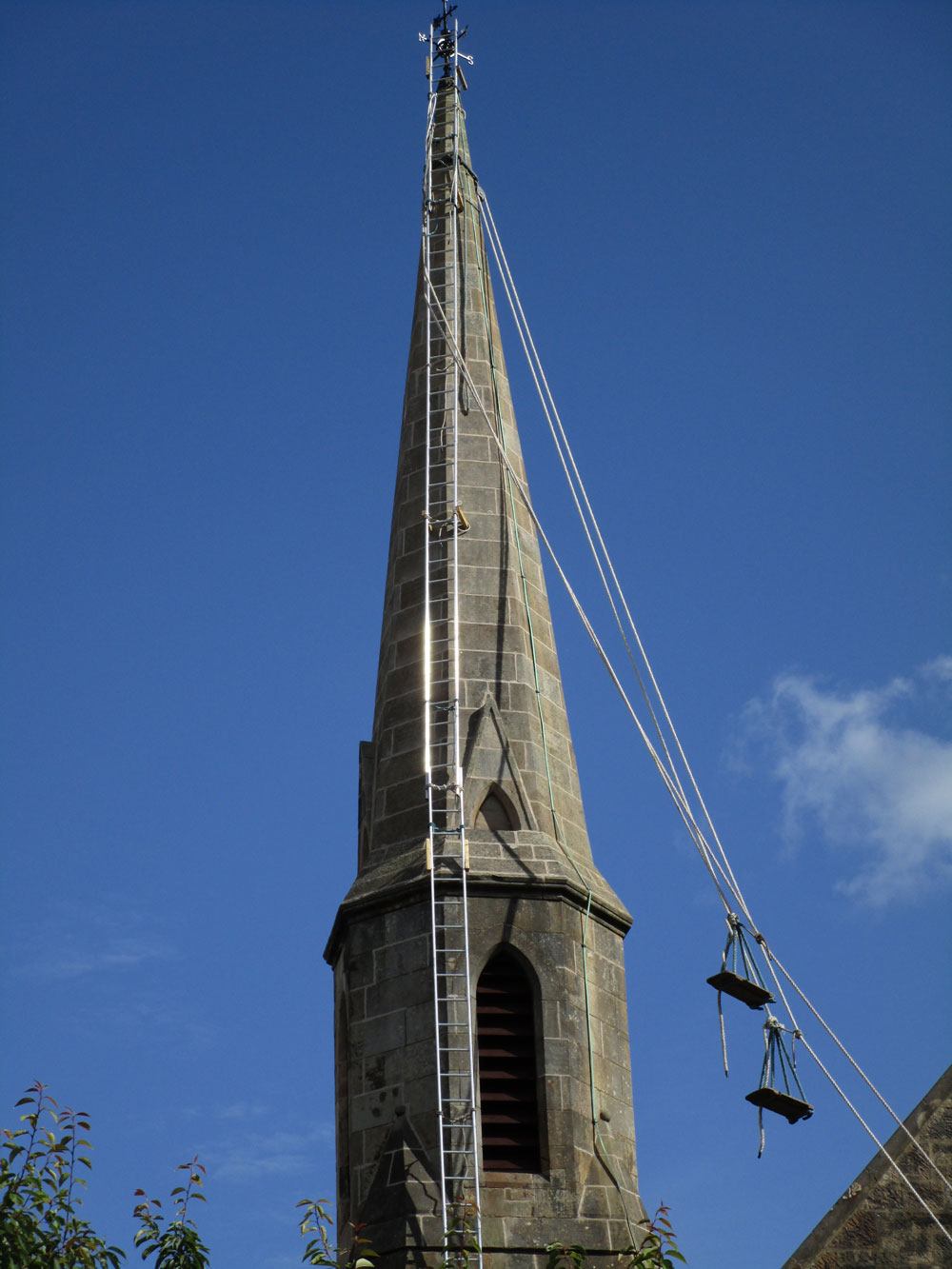 A view of the spire near completion of the work, lime pointing, stabilisation, copper cramps, Scotland