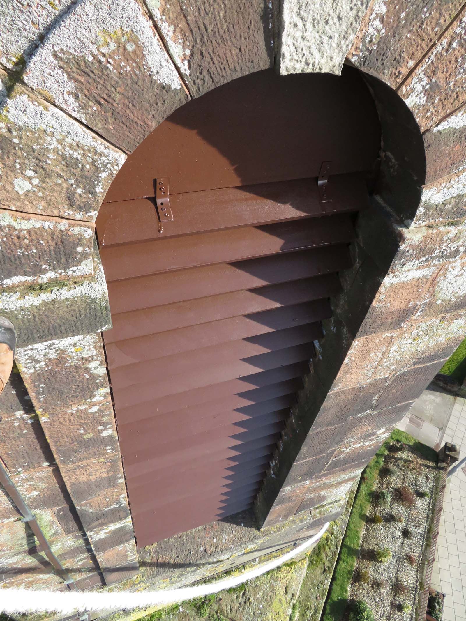 High quality steeplejack installation of sapele hardwood timber louvres on a church spire